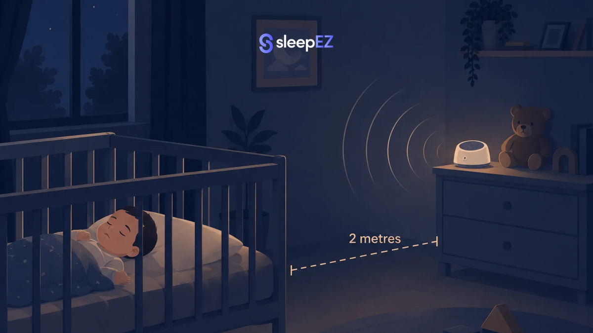 Baby sleeping with sound machine at safe distance
