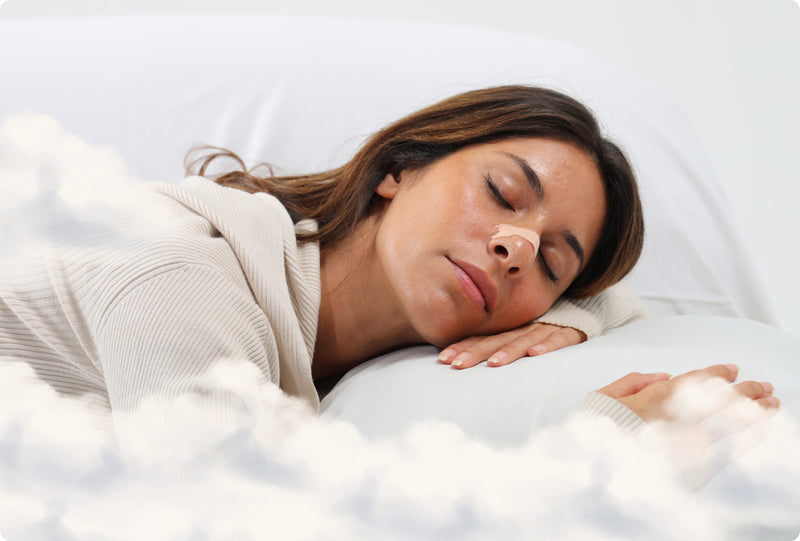 Woman sleeping peacefully with a breathe nasal strip