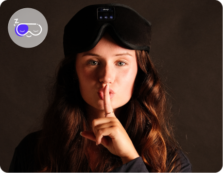 Person wearing a bluetooth sleep mask with a dark background